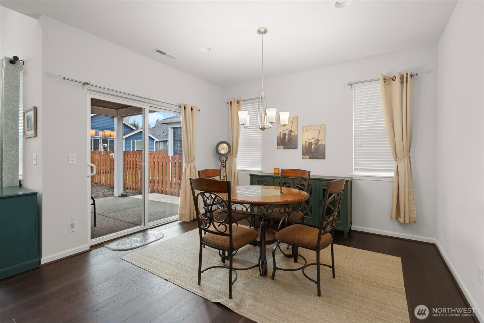 3311 Colville Street Southeast Lacey, WA 98513 - Photo 9 of 40 a view of a dining room with furniture window and wooden floor
