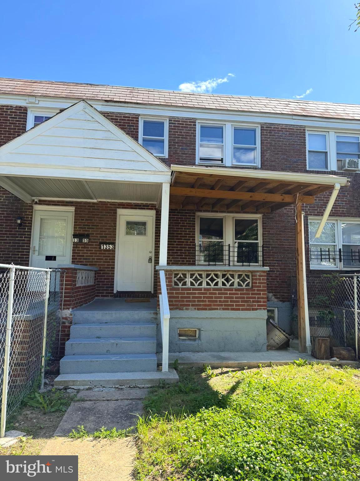 1353 Cambria Street Baltimore, MD 21225 - Photo 1 of 23 a front view of a house with garden