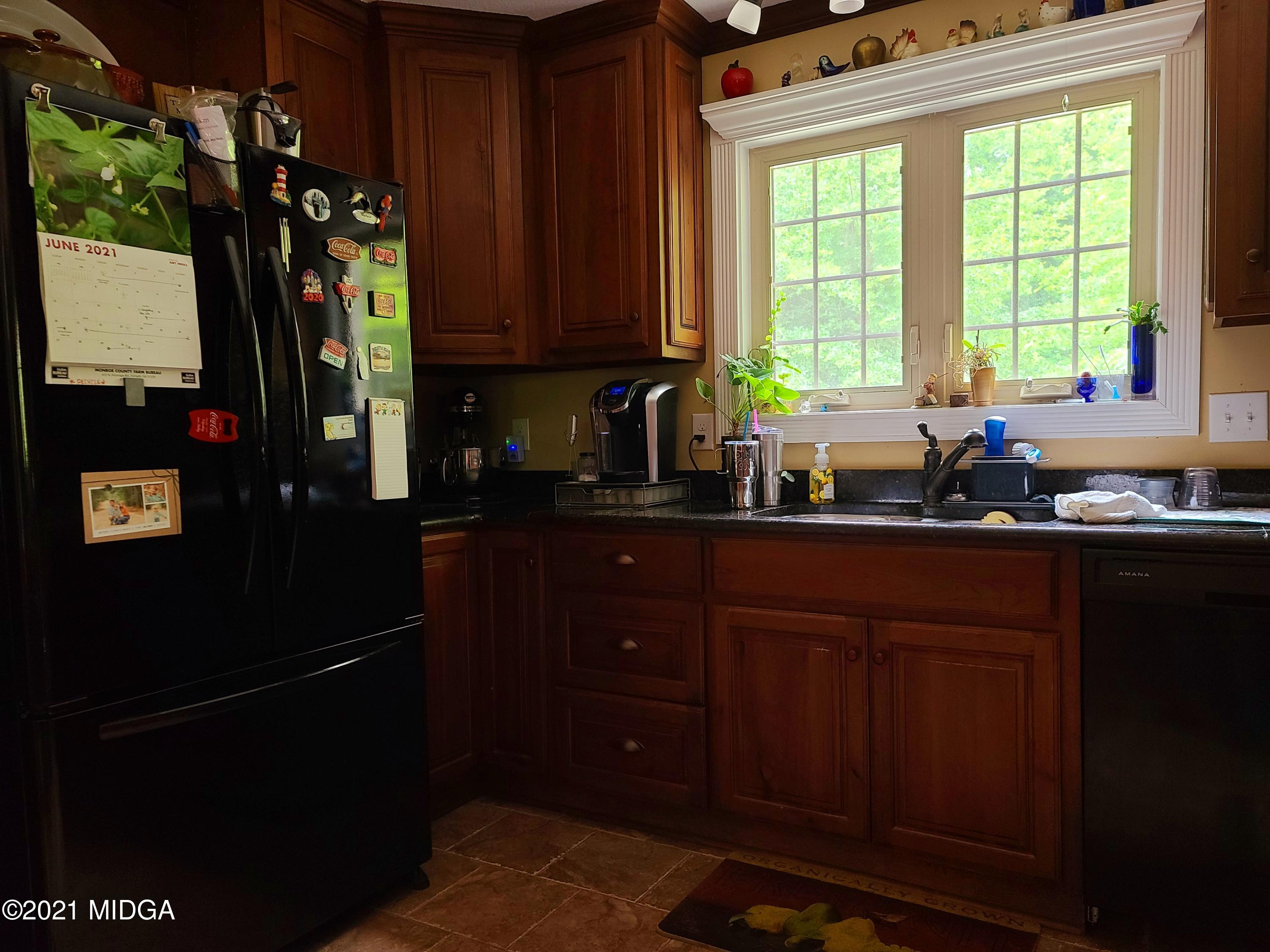 464 Loblolly Lane Macon, GA 31220 - Photo 13 of 48 a kitchen with a window a sink and cabinets