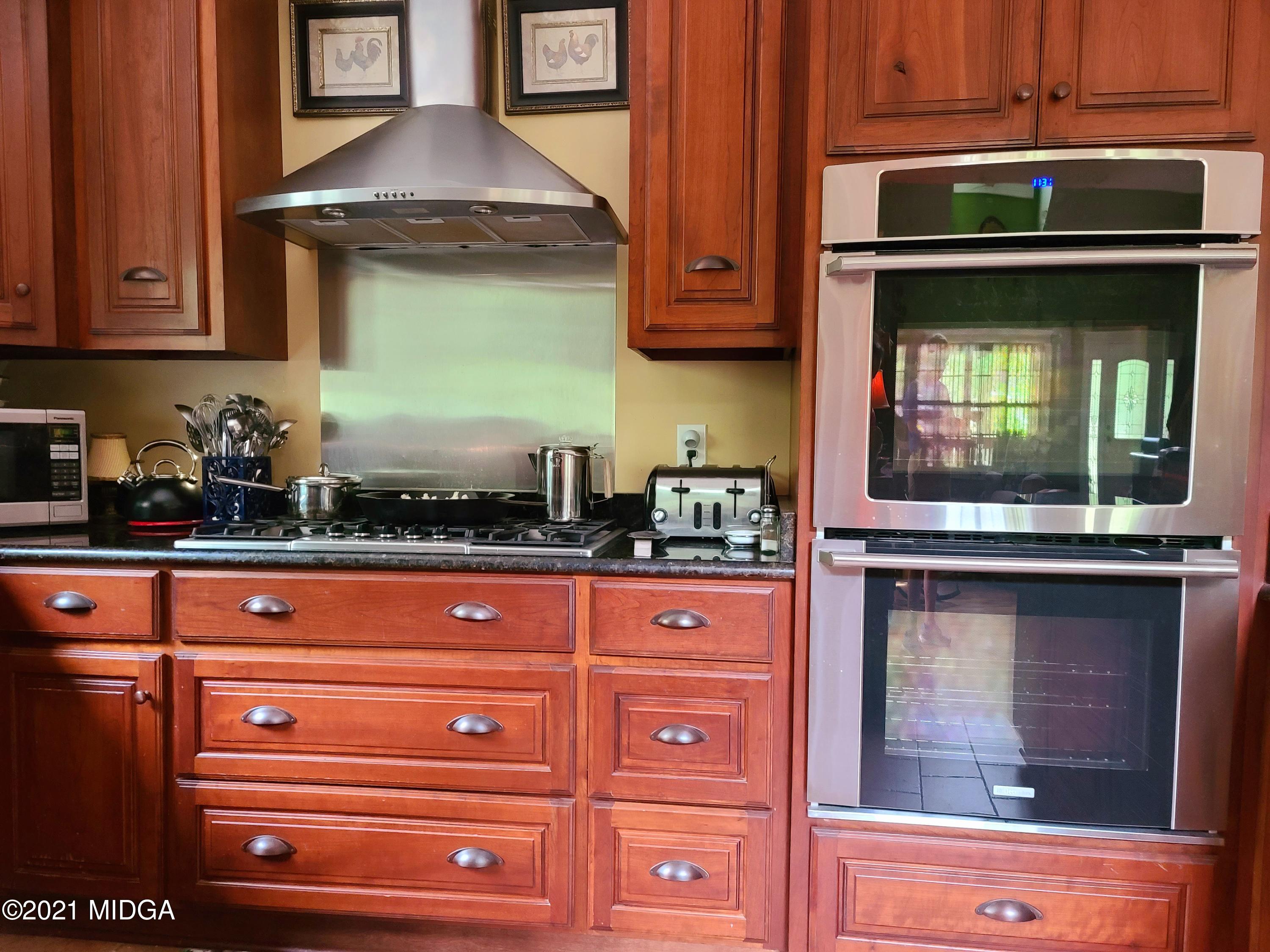 464 Loblolly Lane Macon, GA 31220 - Photo 14 of 48 a kitchen with granite countertop stainless steel appliances and cabinets