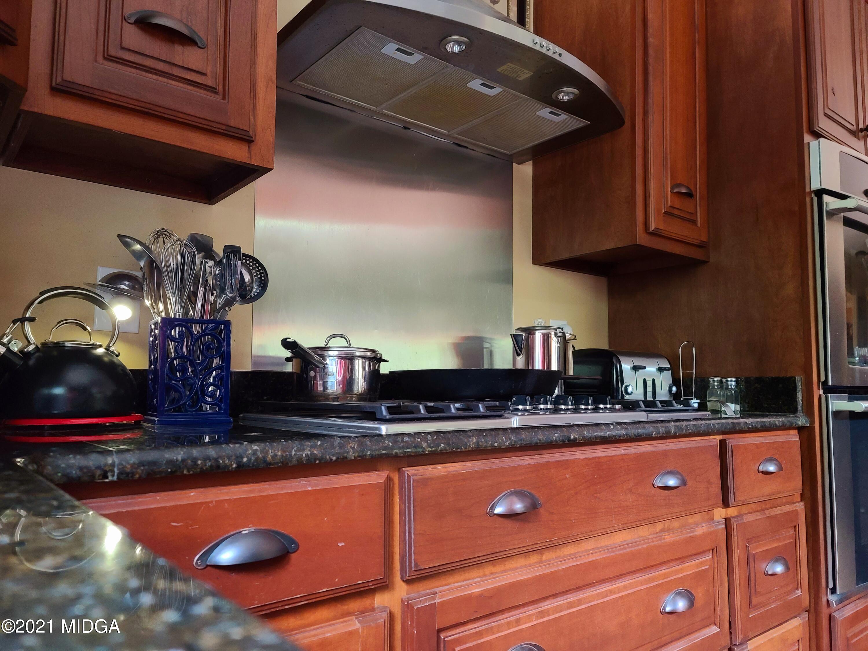 464 Loblolly Lane Macon, GA 31220 - Photo 15 of 48 a kitchen with stainless steel appliances granite countertop a sink and cabinets