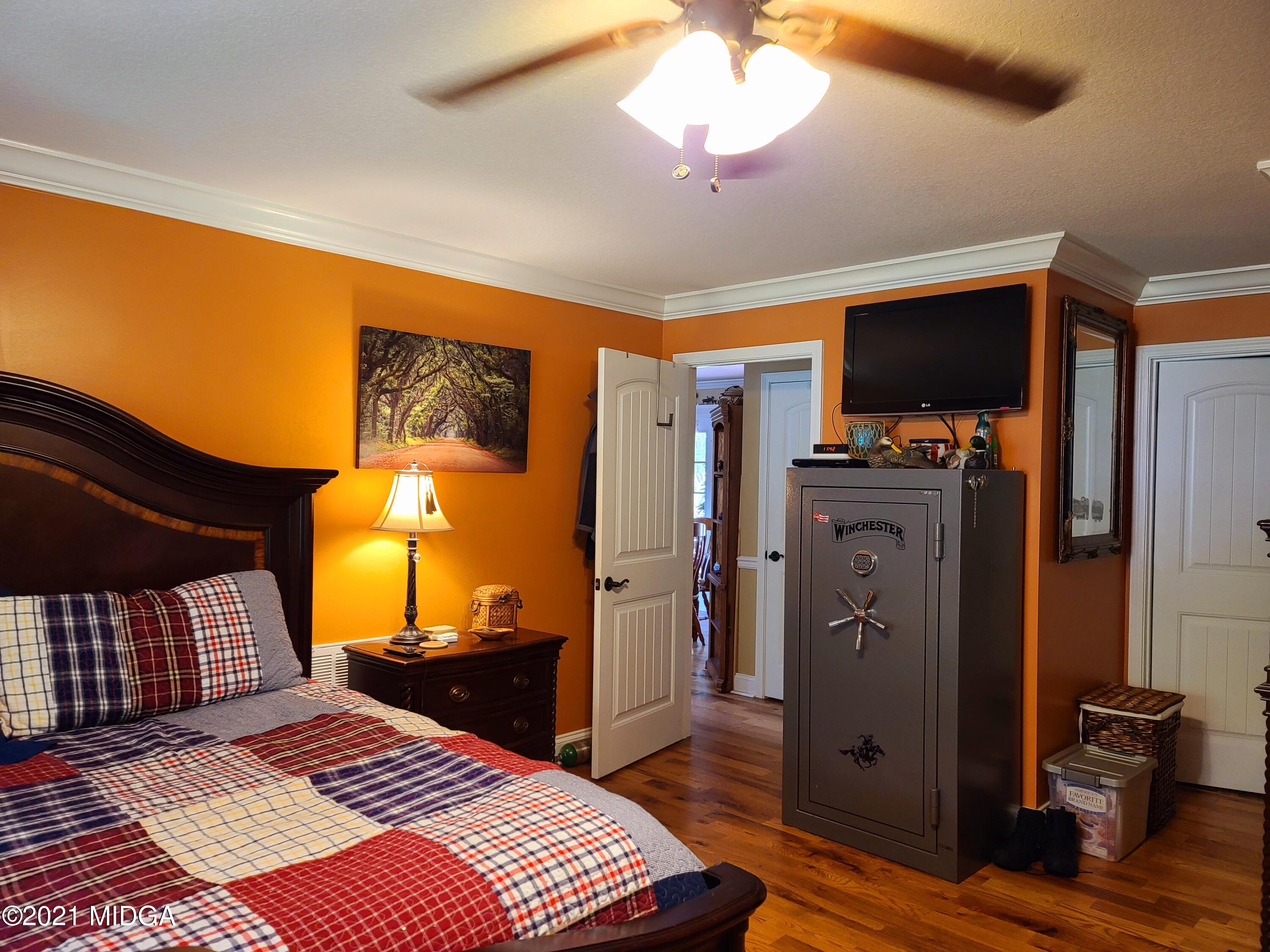 464 Loblolly Lane Macon, GA 31220 - Photo 18 of 48 a bedroom with a bed and a flat screen tv
