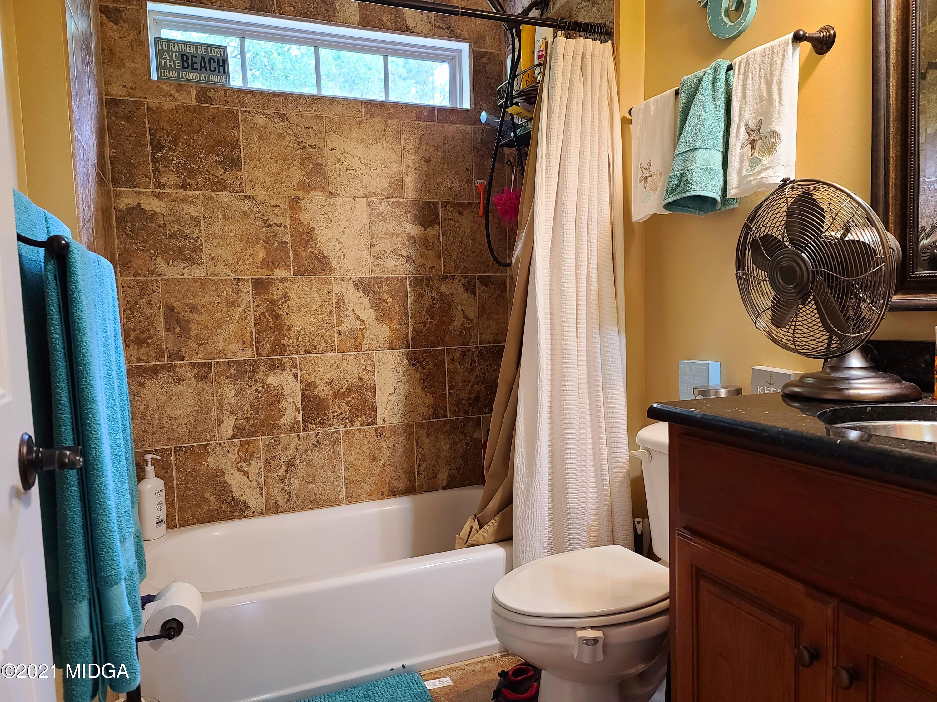 464 Loblolly Lane Macon, GA 31220 - Photo 19 of 48 a bathroom with a toilet and a tub