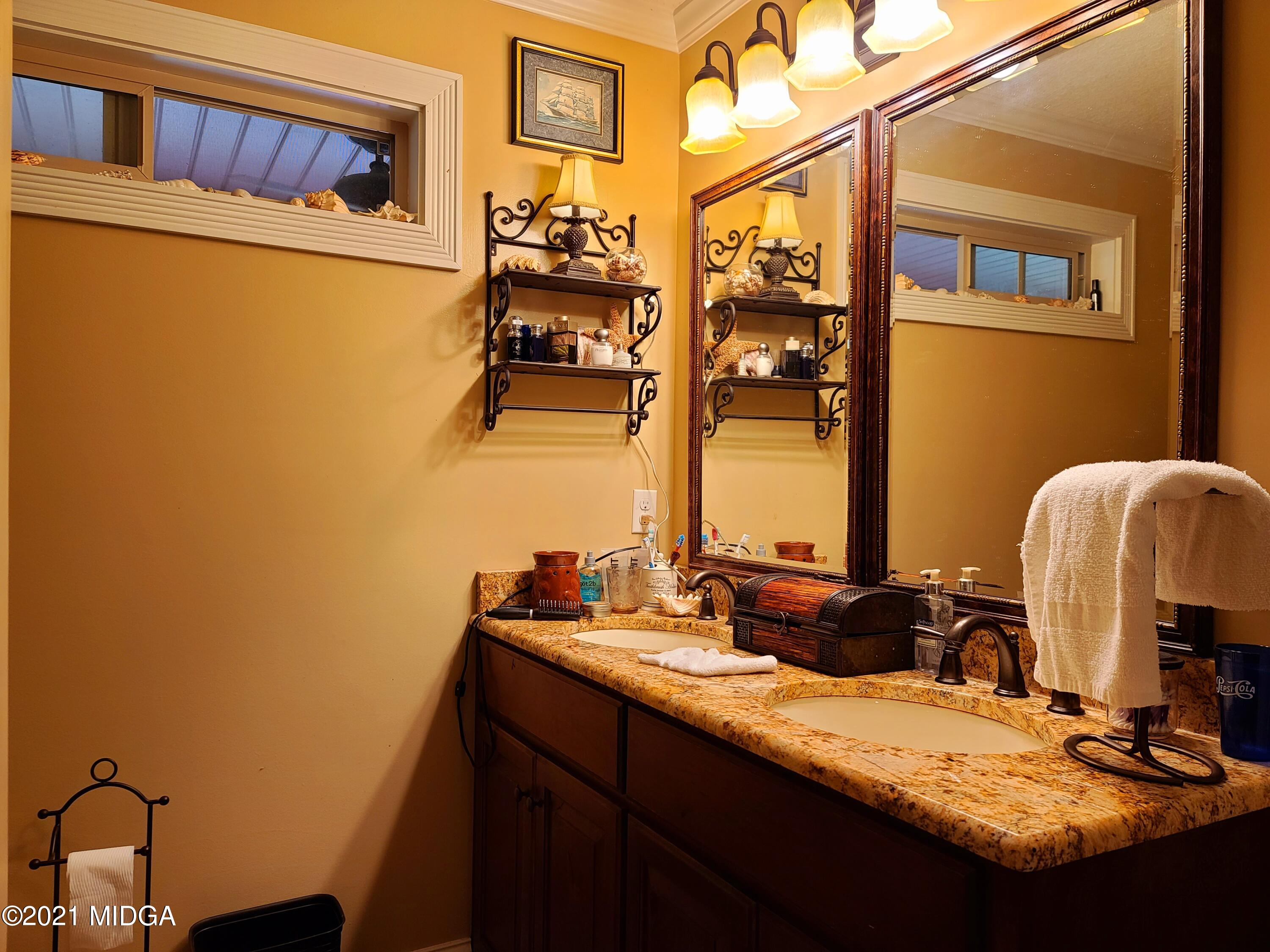 464 Loblolly Lane Macon, GA 31220 - Photo 22 of 48 a bathroom with a sink and a mirror