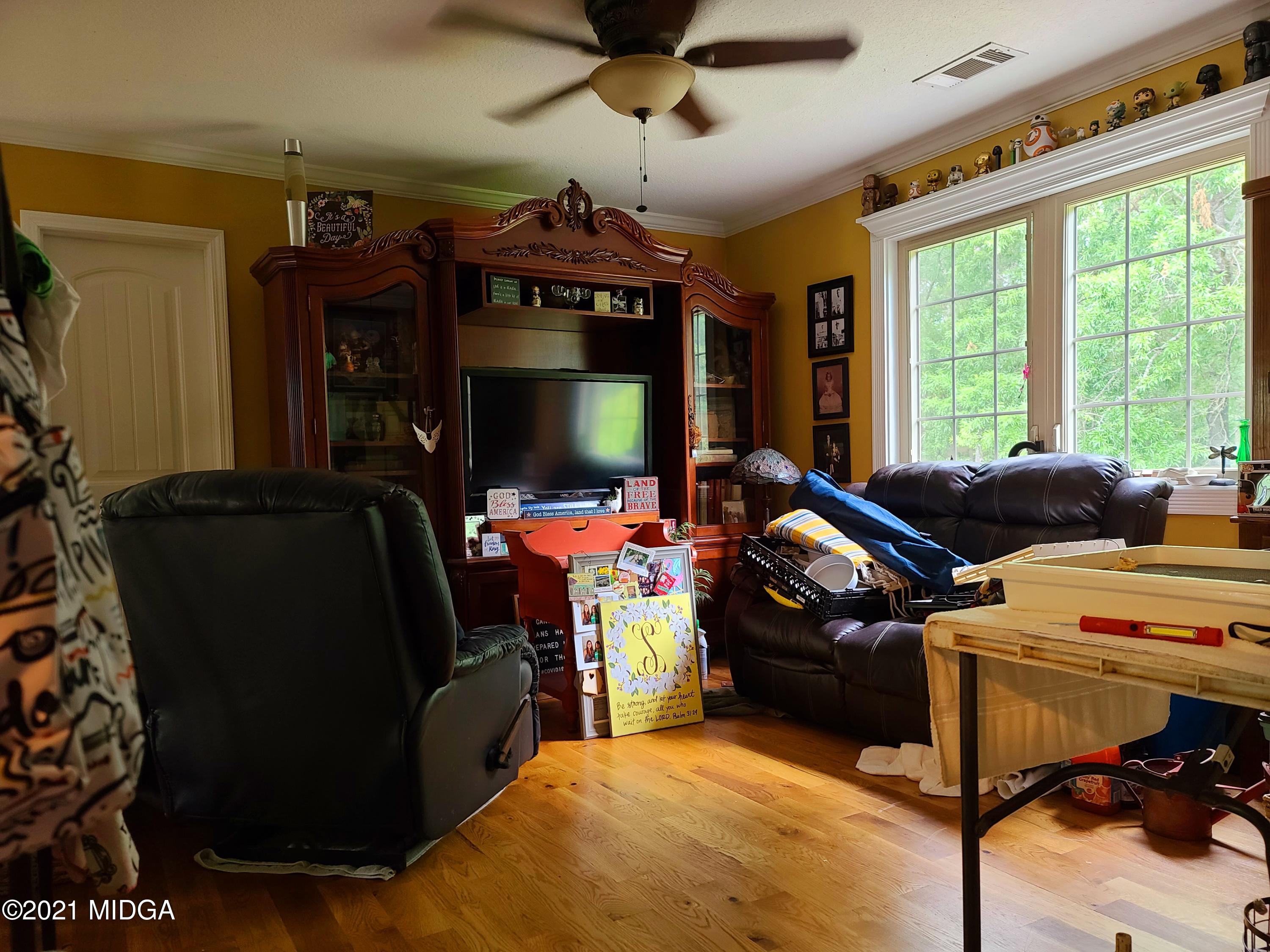 464 Loblolly Lane Macon, GA 31220 - Photo 24 of 48 a room with furniture and a flat screen tv