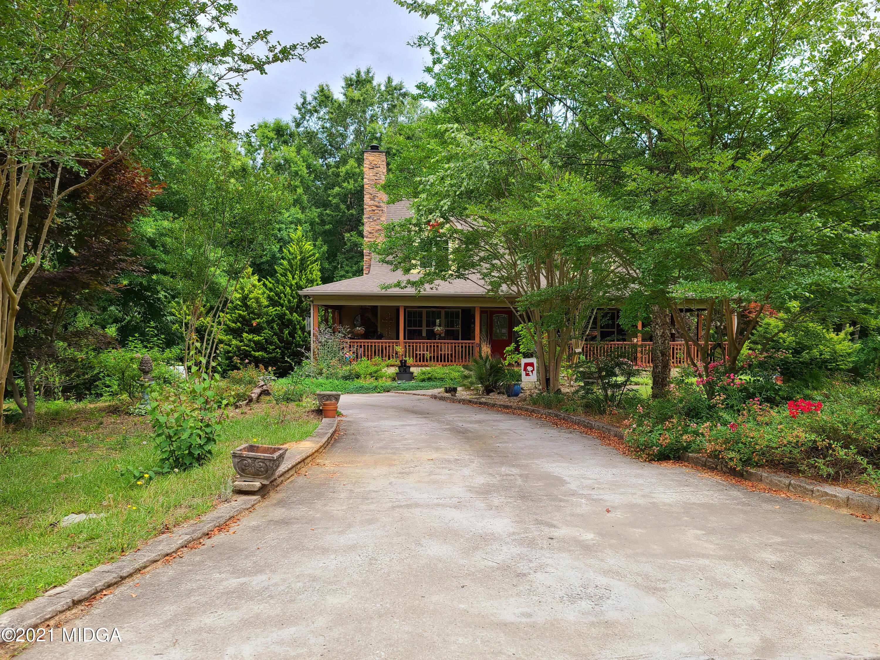 464 Loblolly Lane Macon, GA 31220 - Photo 44 of 48 a front view of a house with a garden