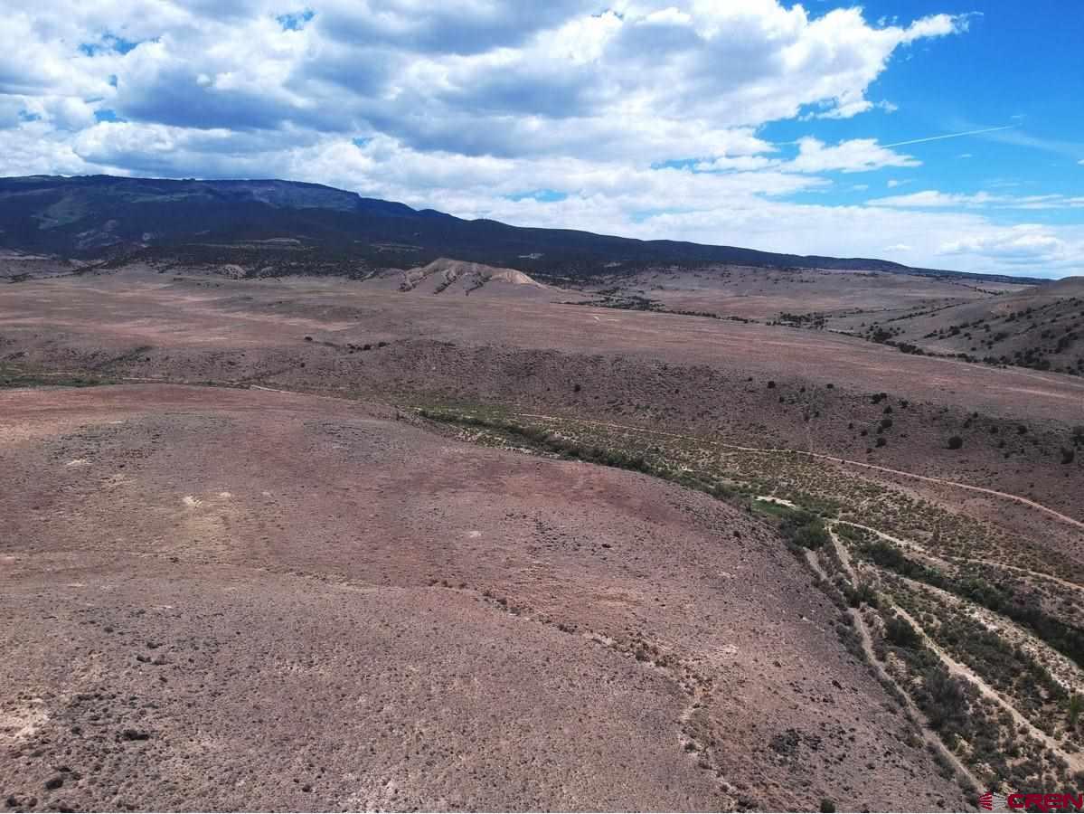 Tbd Bridgeport Road Whitewater, CO 81527 - Photo 2 of 8 a view of a dry yard with wooden fence