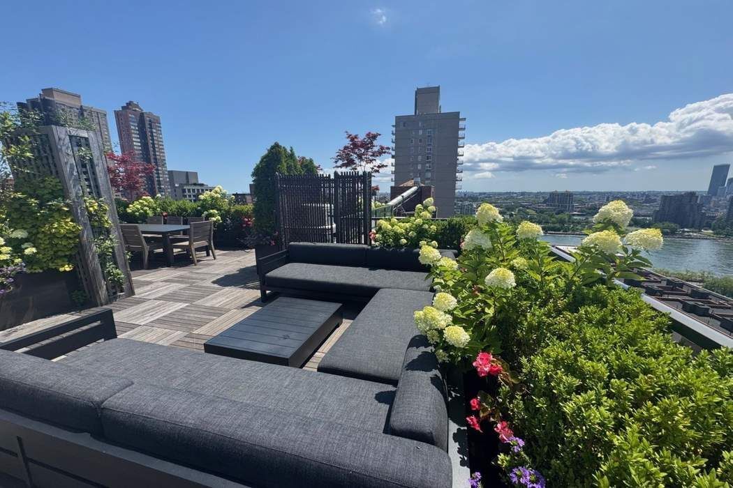 501 East 79th Street, Unit 14E Manhattan, NY 10075 - Photo 16 of 19 a flower garden with lots of potted plants