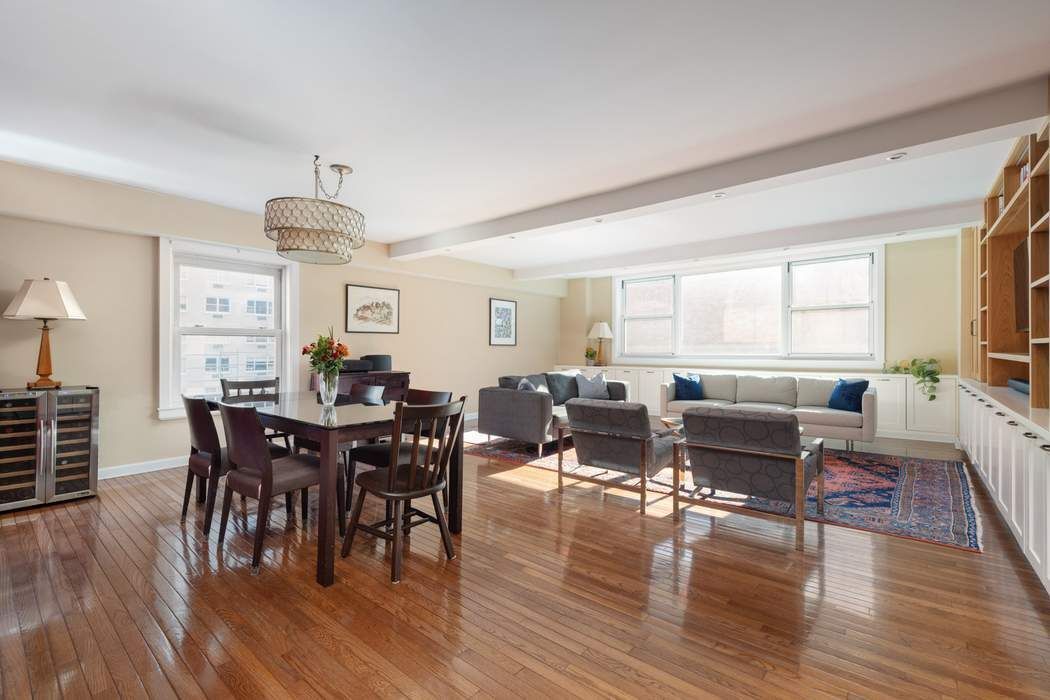 501 East 79th Street, Unit 14E Manhattan, NY 10075 - Photo 3 of 19 a view of a dining room with furniture window and wooden floor