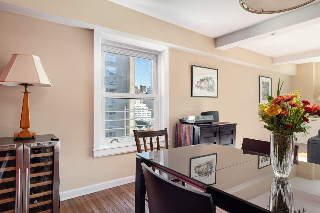 501 East 79th Street, Unit 14E Manhattan, NY 10075 - Photo 4 of 19 a view of a dining room with furniture and wooden floor