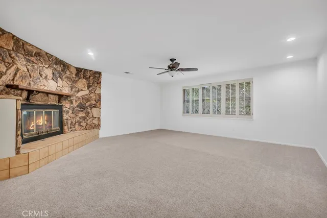 a spacious bathroom with a double vanity sink a mirror and a bathtub