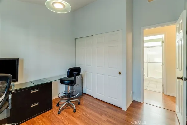 a view of workspace with wooden floor windows