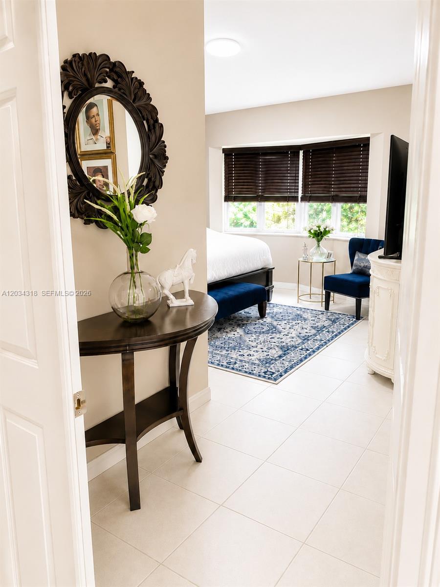 14856 Southwest 179th Street Miami, FL 33187 - Photo 17 of 33 a living room with furniture and a flat screen tv