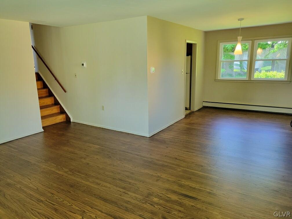 1413 Exeter Road Allentown, PA 18103 - Photo 3 of 16 a view of an empty room with wooden floor and a window