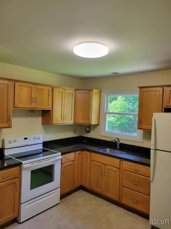 1413 Exeter Road Allentown, PA 18103 - Photo 4 of 16 a kitchen with granite countertop white cabinets and white appliances