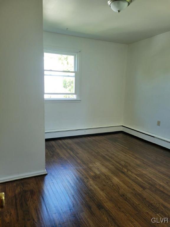 1413 Exeter Road Allentown, PA 18103 - Photo 6 of 16 an empty room with wooden floor and windows