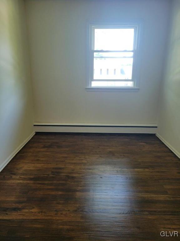 1413 Exeter Road Allentown, PA 18103 - Photo 7 of 16 an empty room with wooden floor and windows