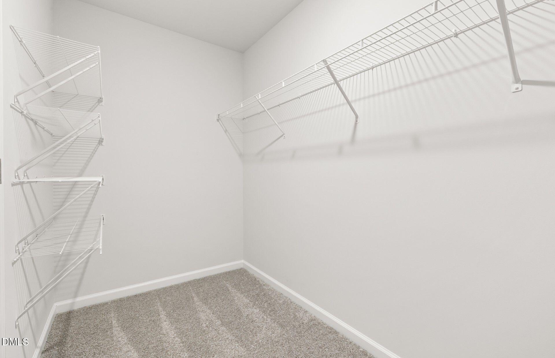 637 Fosterton Cottage Way Raleigh, NC 27603 - Photo 13 of 31 a view of a room with racks on the wall