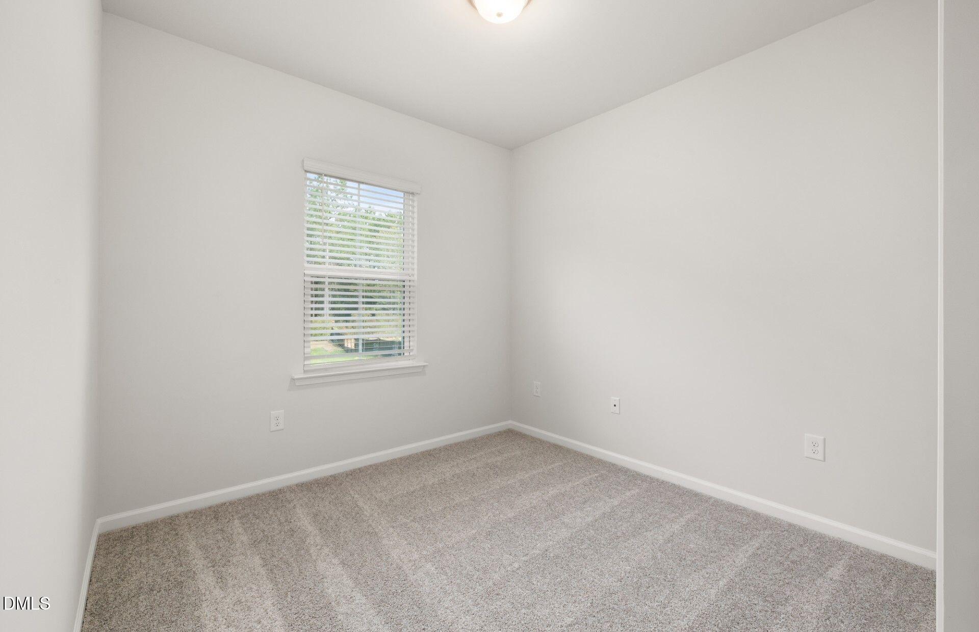 637 Fosterton Cottage Way Raleigh, NC 27603 - Photo 19 of 31 an empty room with a window