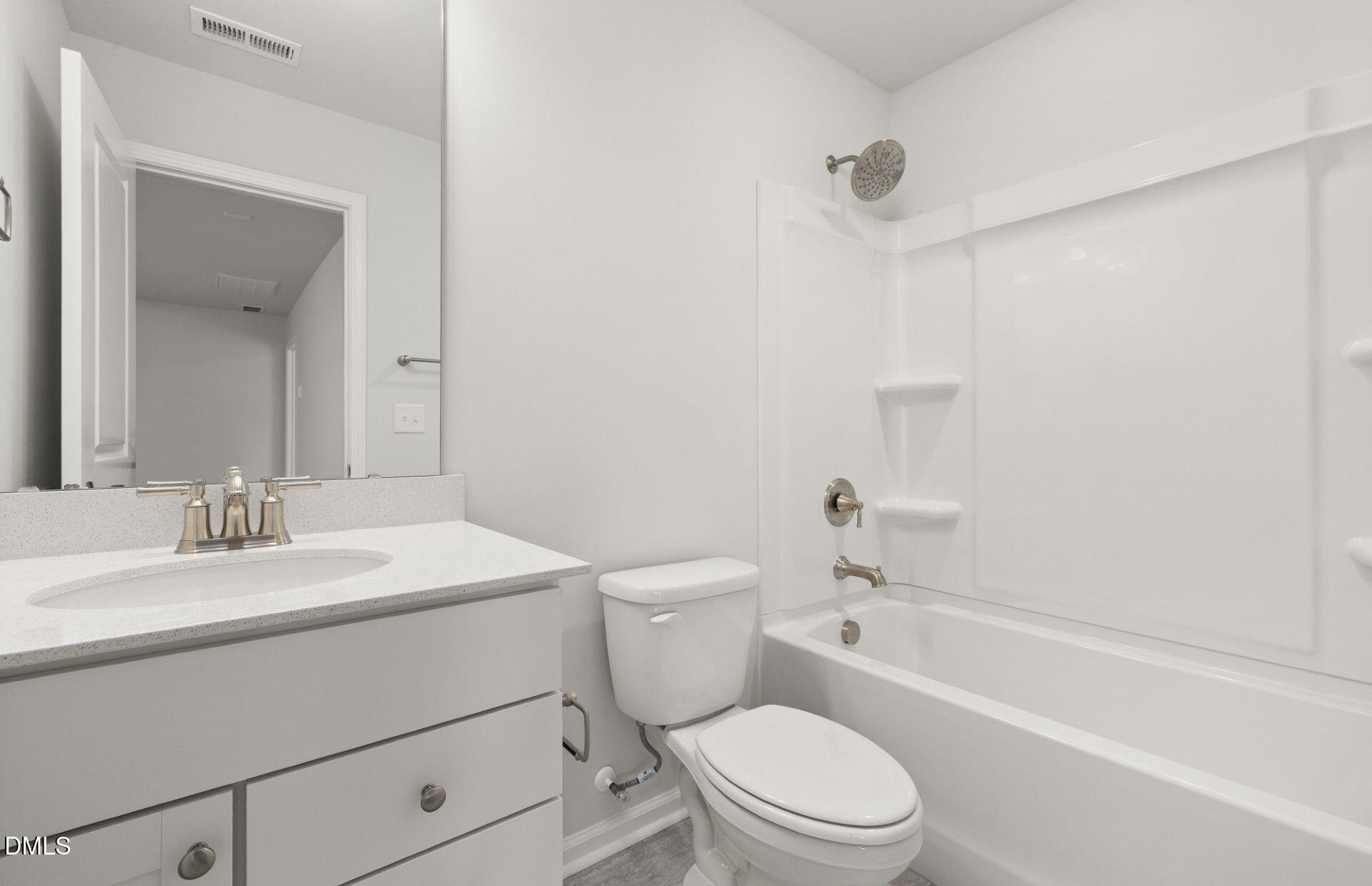 637 Fosterton Cottage Way Raleigh, NC 27603 - Photo 20 of 31 a bathroom with a sink a toilet and shower