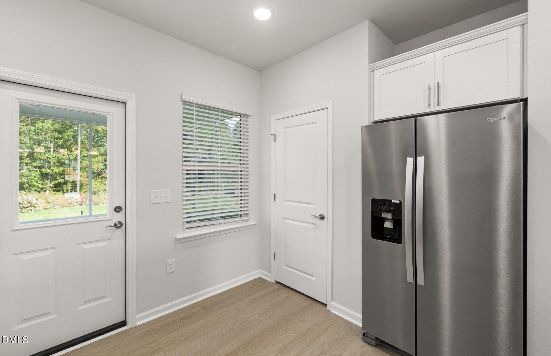 637 Fosterton Cottage Way Raleigh, NC 27603 - Photo 6 of 31 a view of a kitchen with closet and window