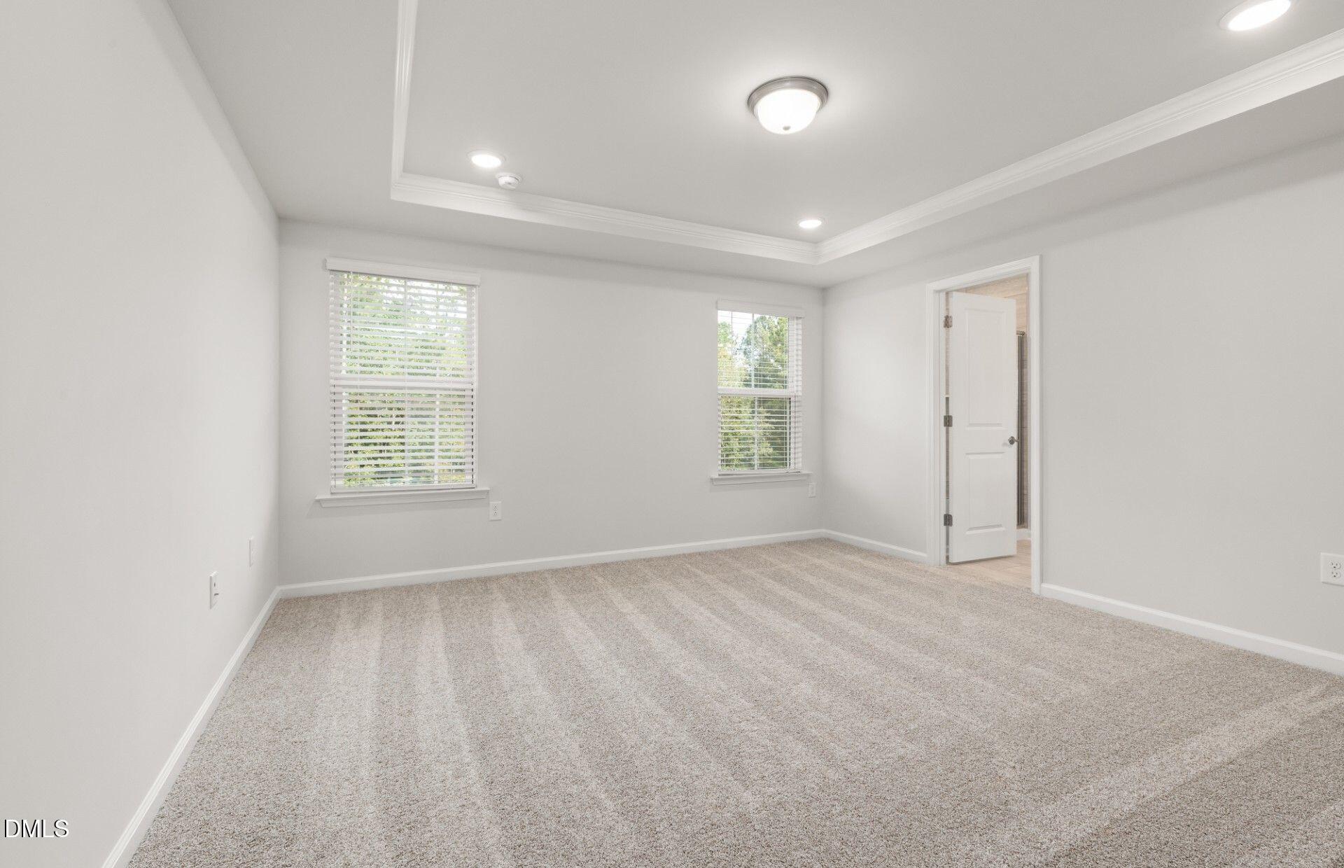637 Fosterton Cottage Way Raleigh, NC 27603 - Photo 9 of 31 an empty room with windows