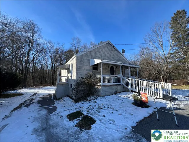 a backyard of a house with seating space