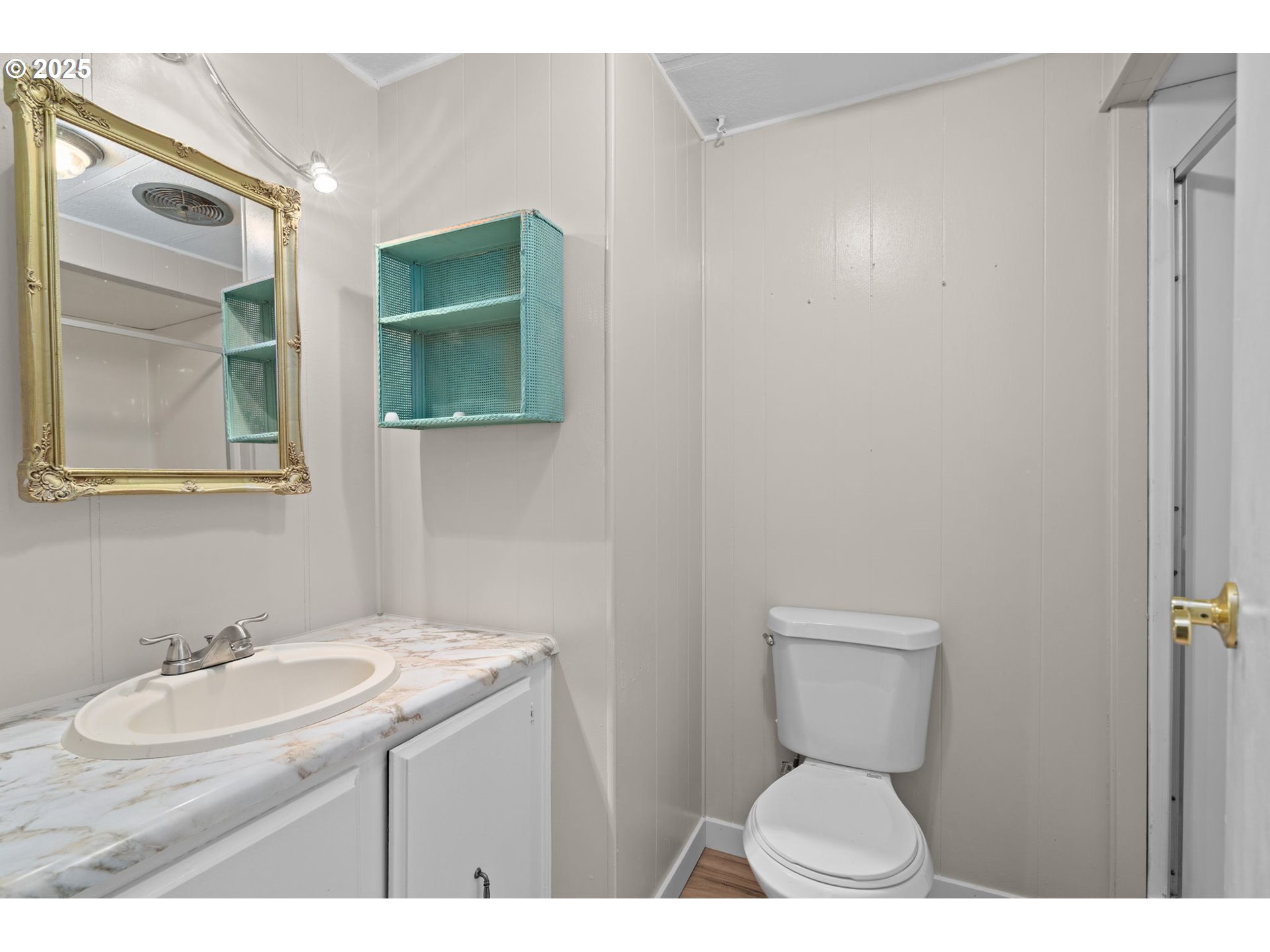 2657 North Highway 101, Unit 6 Seaside, OR 97138 - Photo 11 of 13 a bathroom with a sink toilet and mirror
