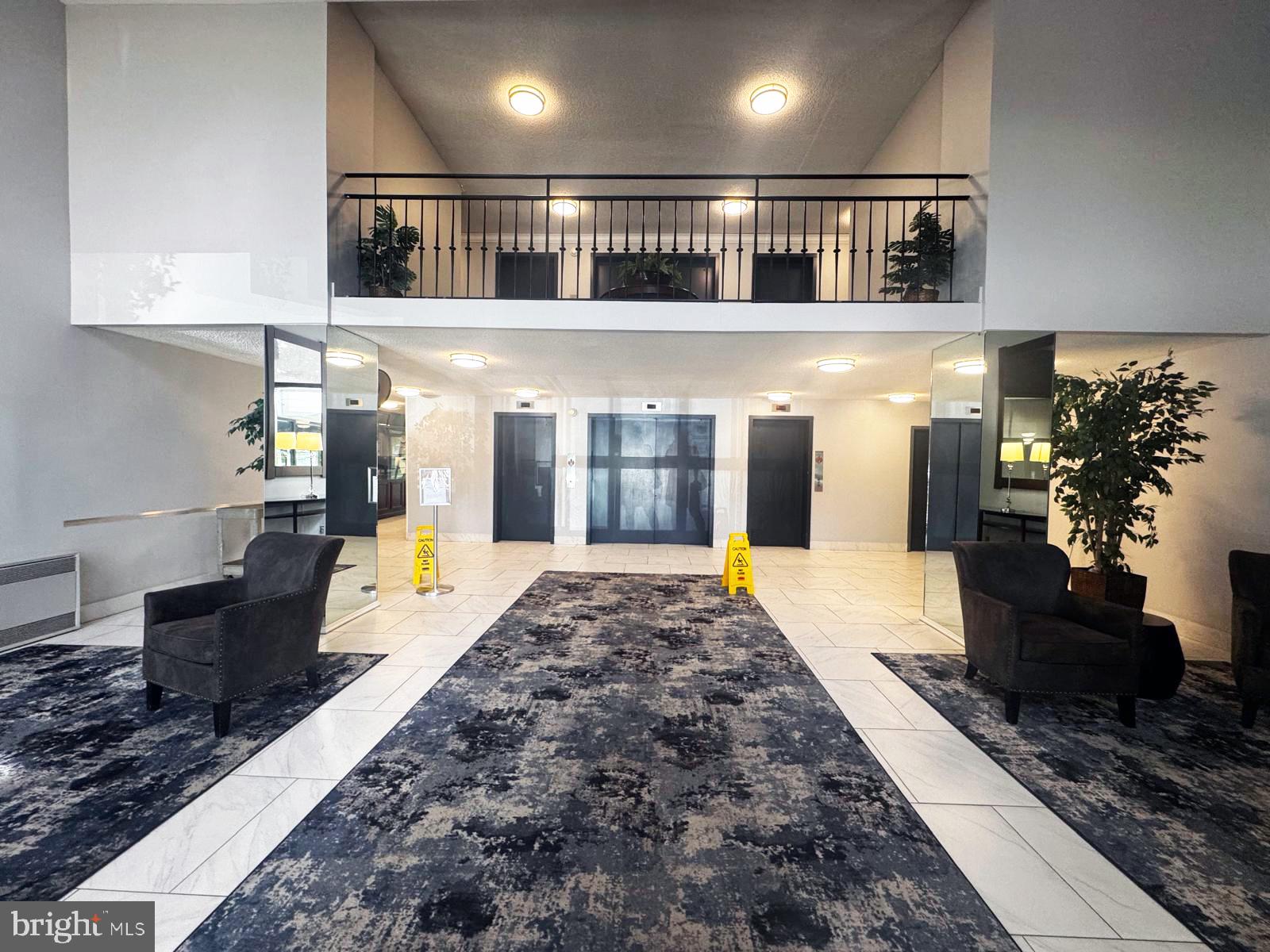 2059 Huntington Avenue, Unit 1101 Alexandria, VA 22303 - Photo 25 of 35 a living room with stainless steel appliances granite countertop furniture a rug kitchen view and a chandelier