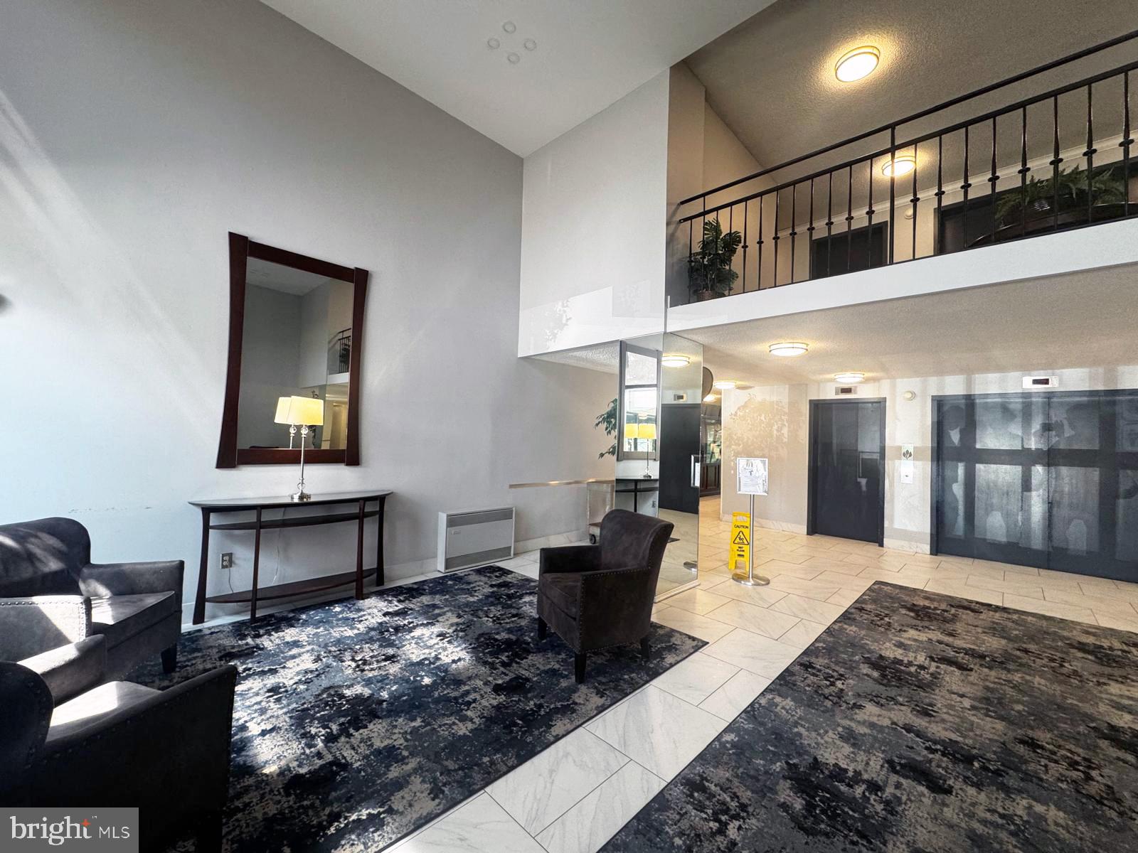 2059 Huntington Avenue, Unit 1101 Alexandria, VA 22303 - Photo 28 of 35 a living room with furniture and a wooden floor