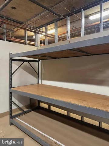 a view of a room with wooden floor and windows