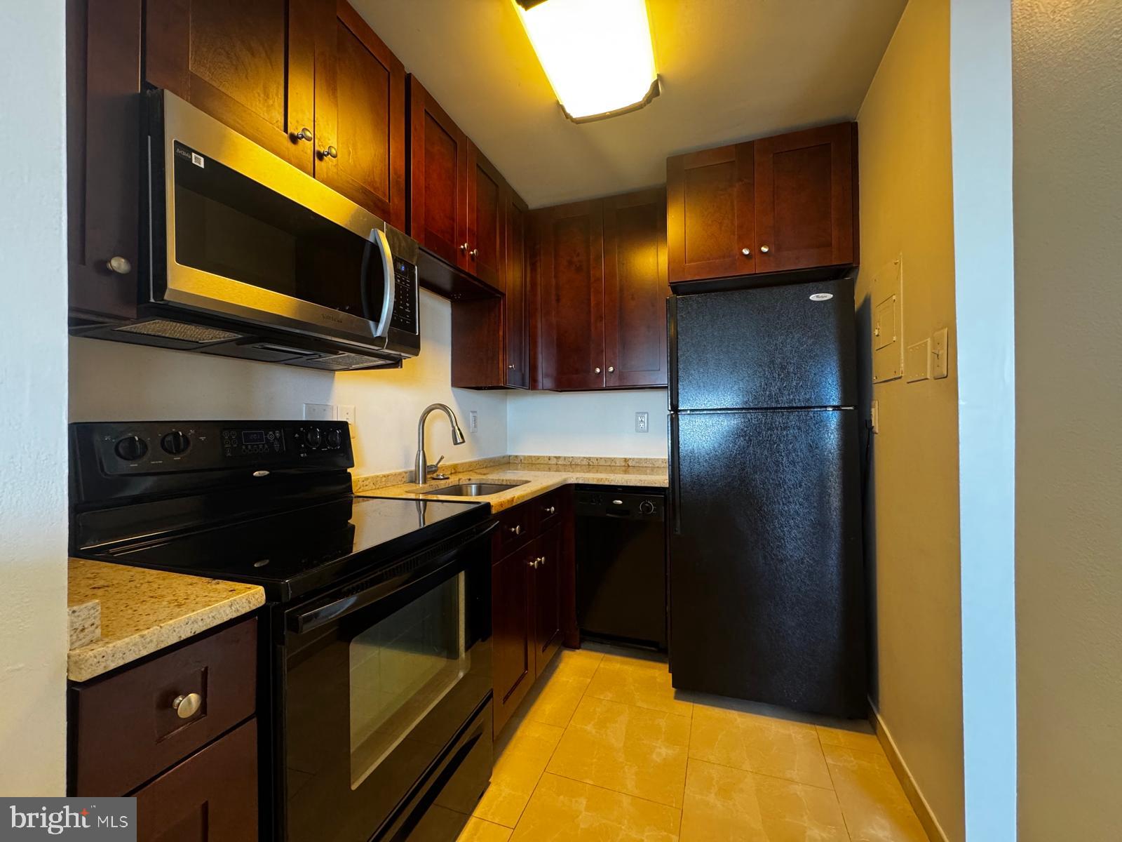 2059 Huntington Avenue, Unit 1101 Alexandria, VA 22303 - Photo 6 of 35 a kitchen with a sink and cabinets