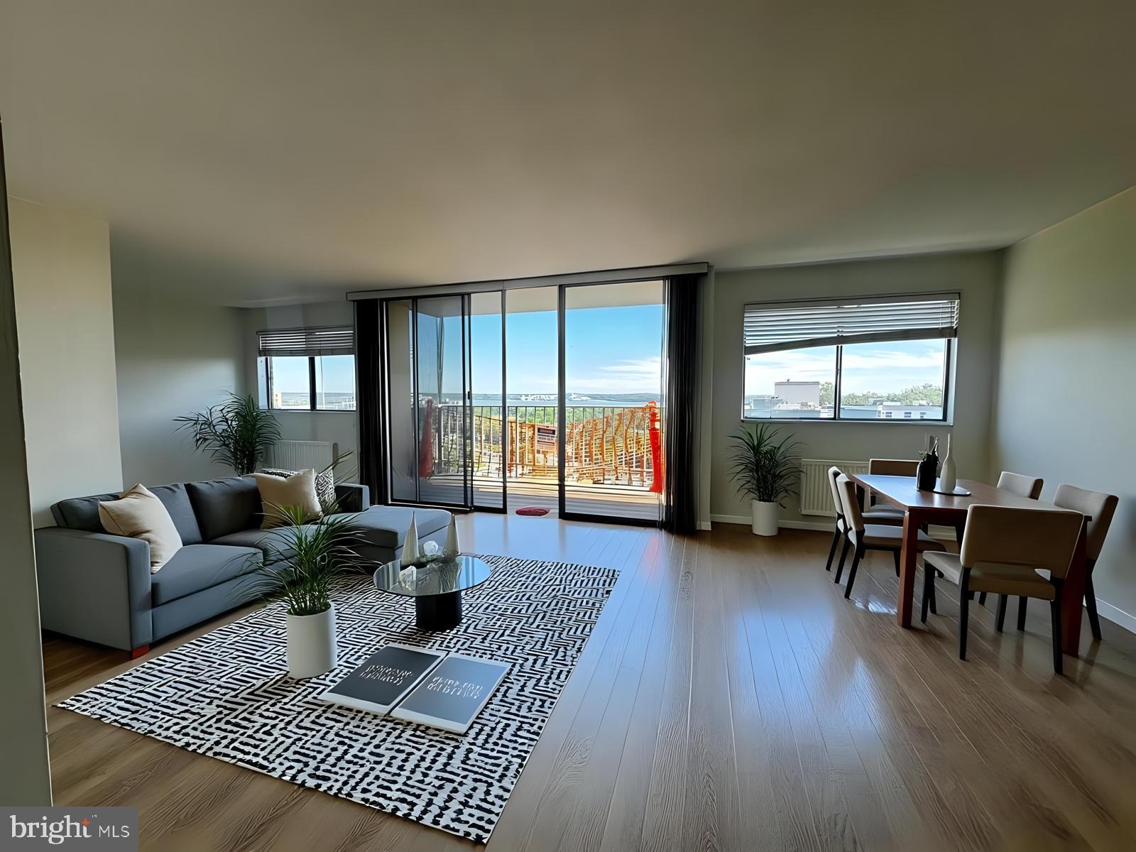 2059 Huntington Avenue, Unit 1101 Alexandria, VA 22303 - Photo 7 of 35 a living room with furniture and wooden floor