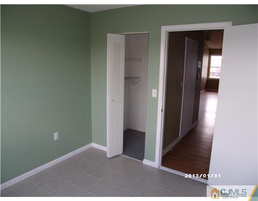 236 Edpas Road New Brunswick, NJ 08901 - Photo 13 of 15 a view of a hallway with wooden floor