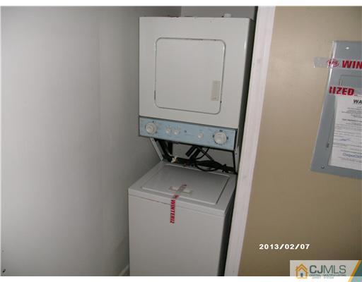 236 Edpas Road New Brunswick, NJ 08901 - Photo 15 of 15 a utility room with dryer and washer