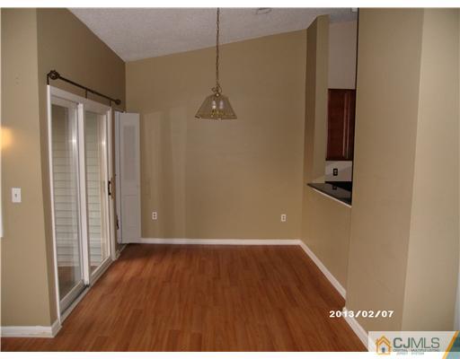 236 Edpas Road New Brunswick, NJ 08901 - Photo 5 of 15 a view of a hallway with wooden floor and a bathroom