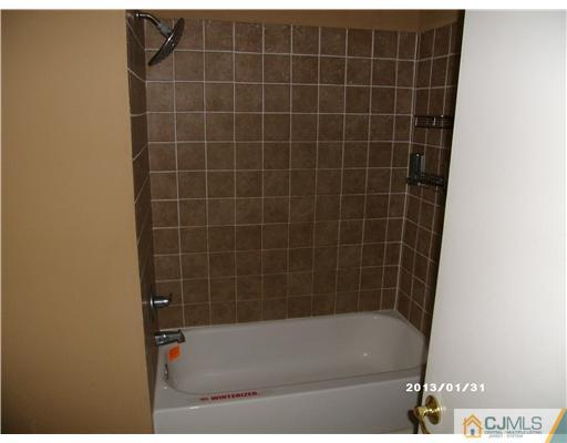 236 Edpas Road New Brunswick, NJ 08901 - Photo 8 of 15 a bathroom with a bathtub