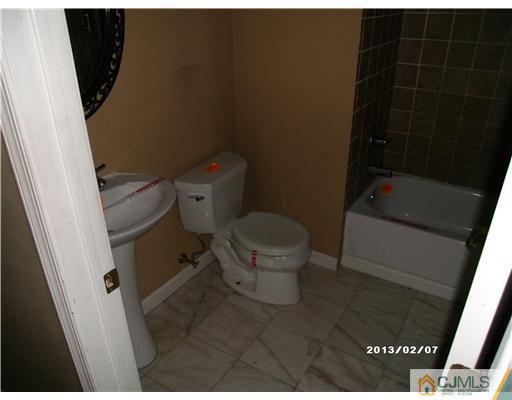 236 Edpas Road New Brunswick, NJ 08901 - Photo 9 of 15 a bathroom with a toilet and a shower