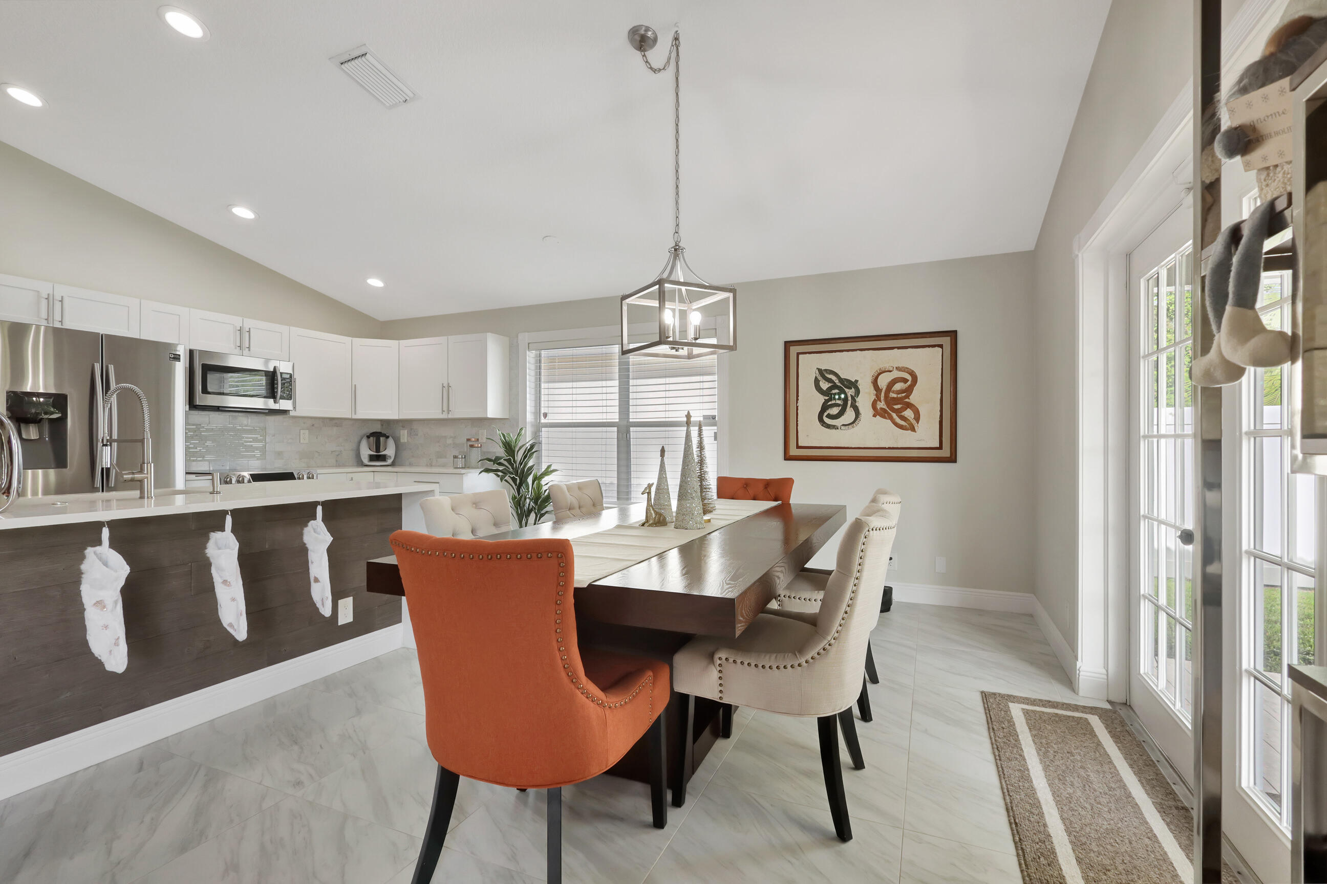 12204 Sunset Point Circle Wellington, FL 33414 - Photo 11 of 40 a dining room with furniture and window