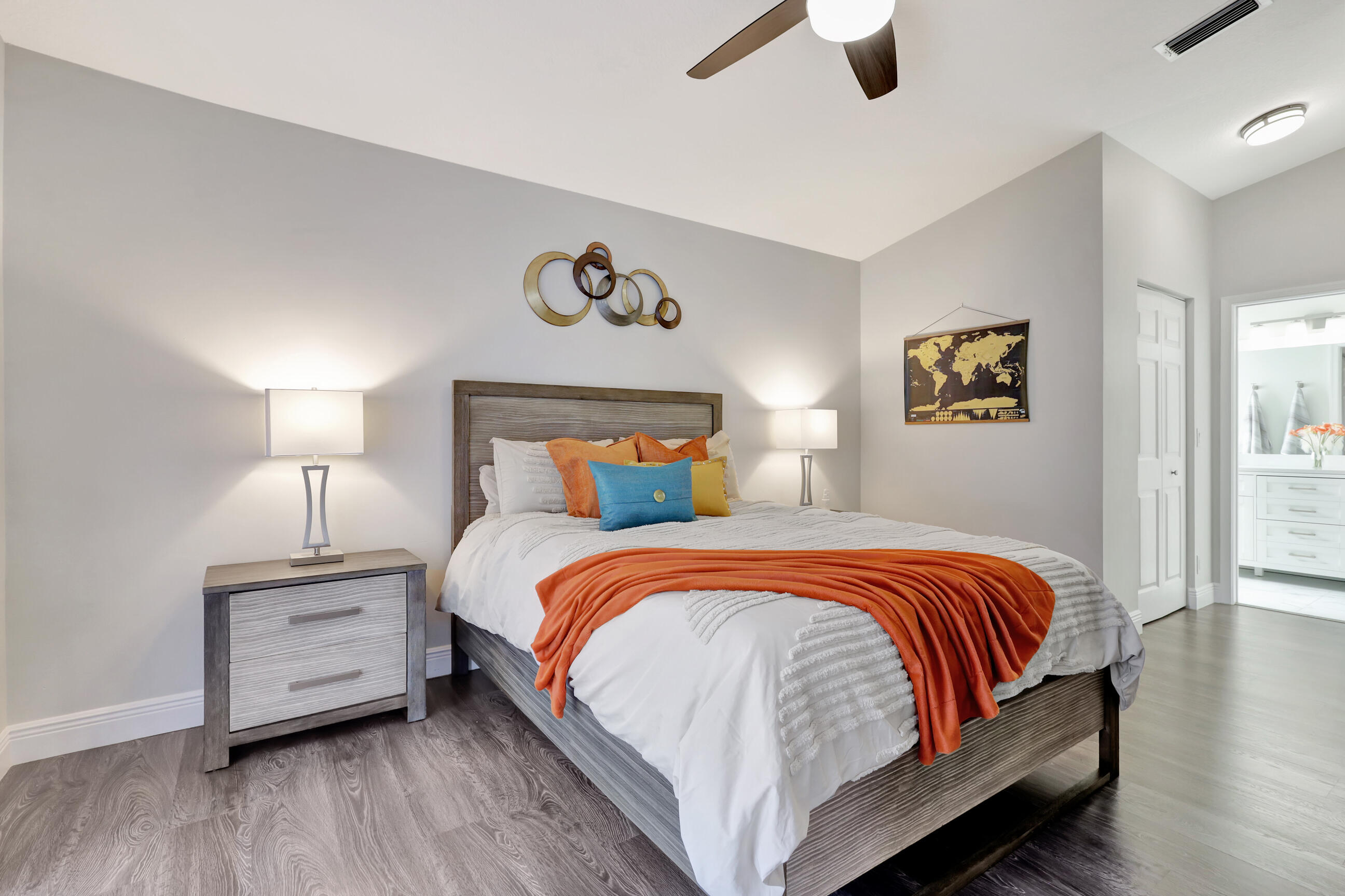 12204 Sunset Point Circle Wellington, FL 33414 - Photo 17 of 40 a bedroom with a bed and a painting on the wall