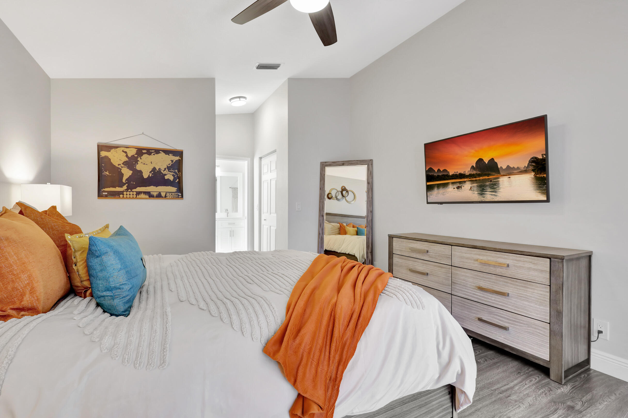 12204 Sunset Point Circle Wellington, FL 33414 - Photo 18 of 40 a bedroom with a bed and a painting on the wall