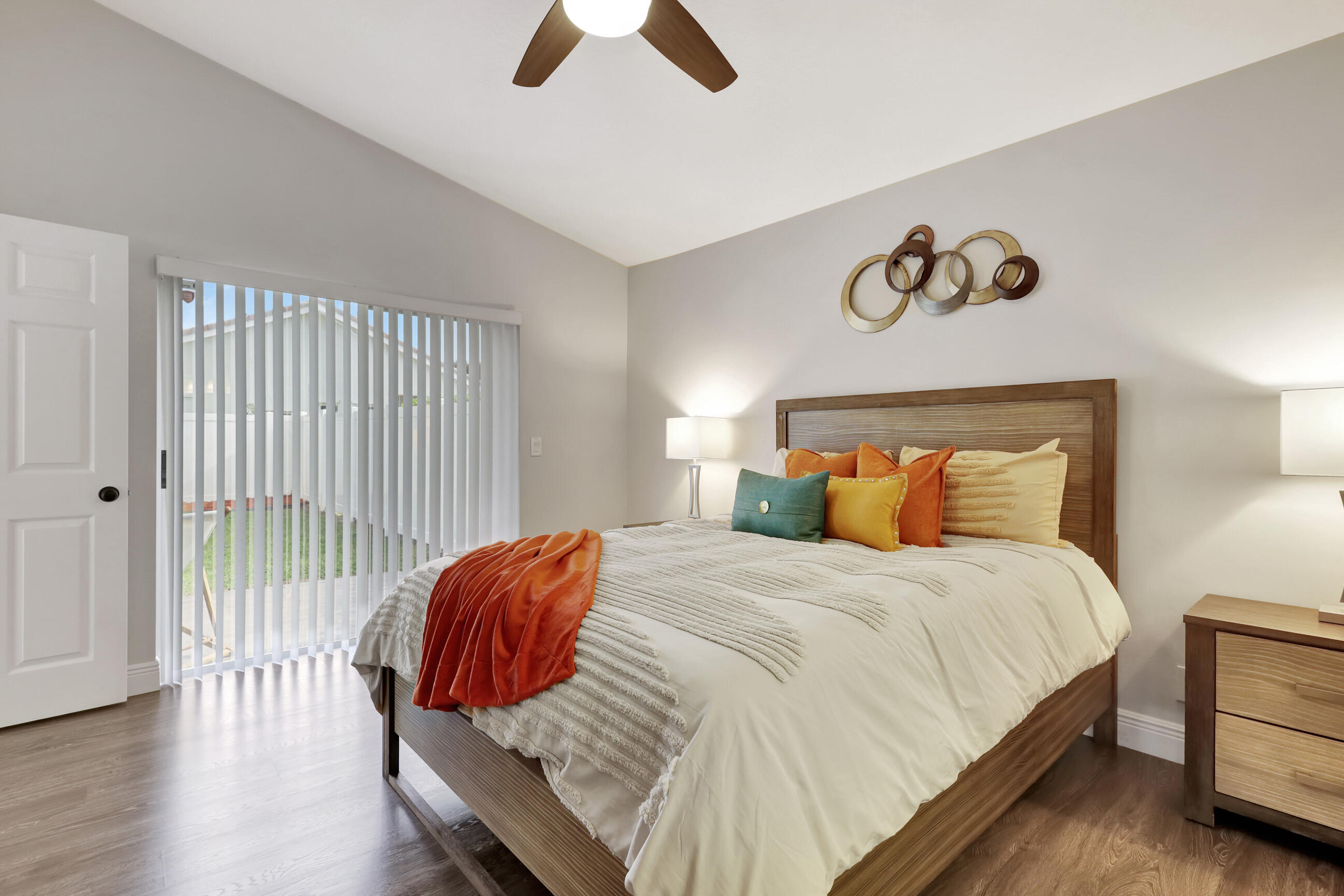 12204 Sunset Point Circle Wellington, FL 33414 - Photo 19 of 40 a bedroom with a bed and wooden floor