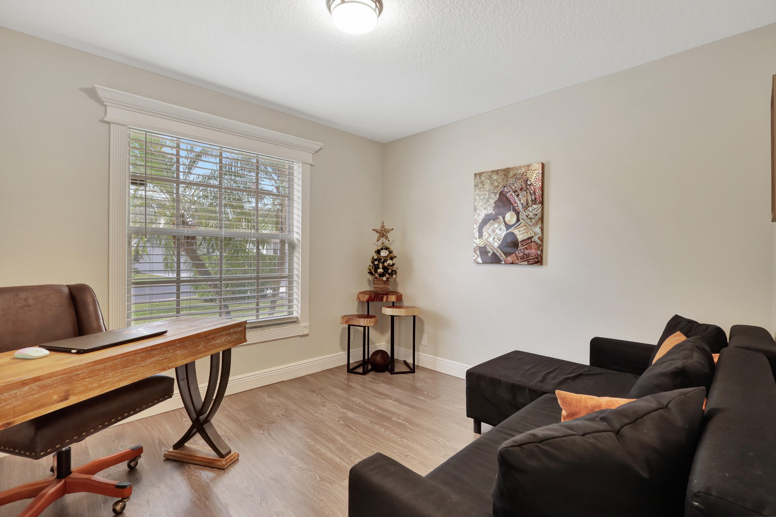 12204 Sunset Point Circle Wellington, FL 33414 - Photo 22 of 40 a living room with furniture and a window