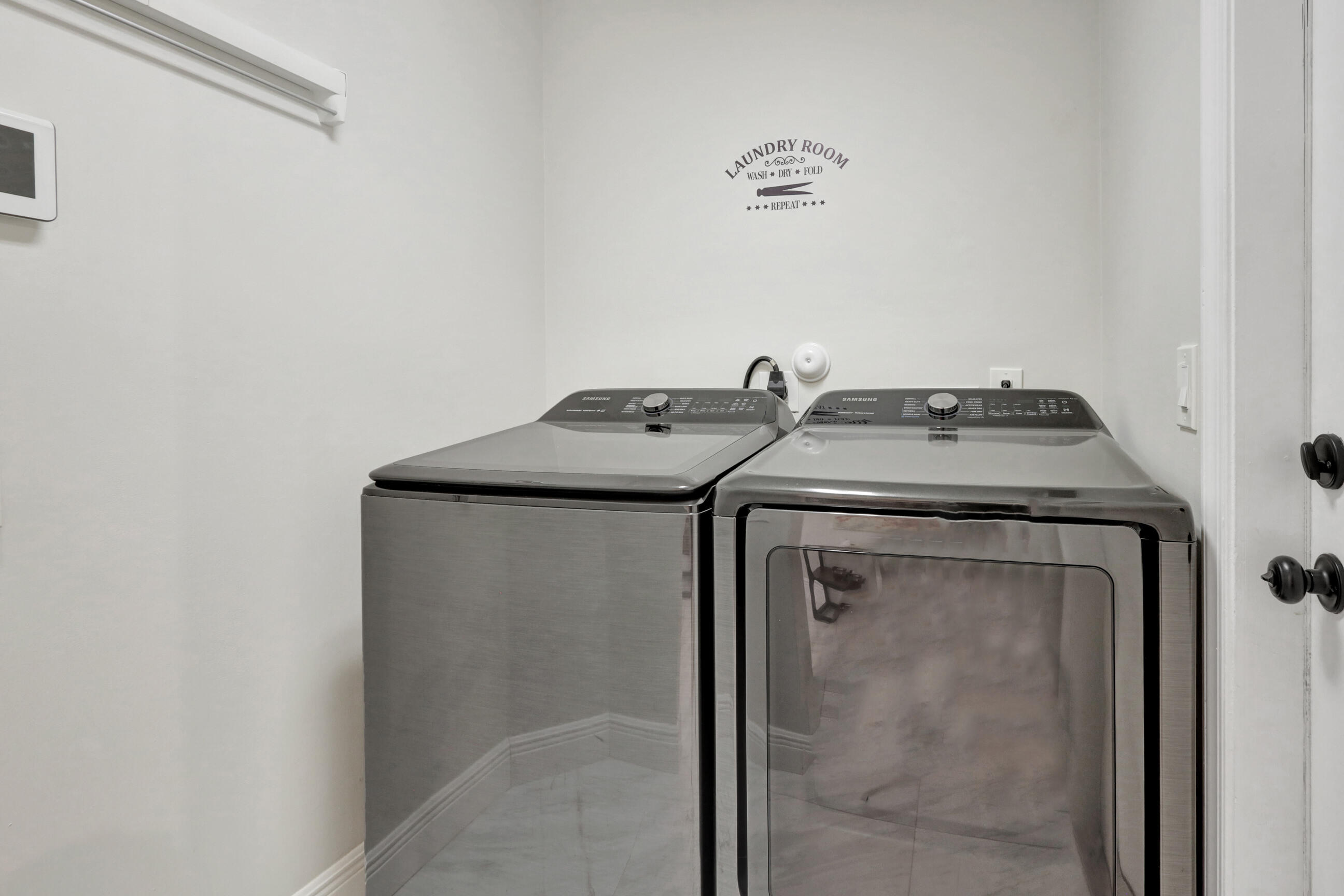 12204 Sunset Point Circle Wellington, FL 33414 - Photo 27 of 40 a utility room with dryer and washer