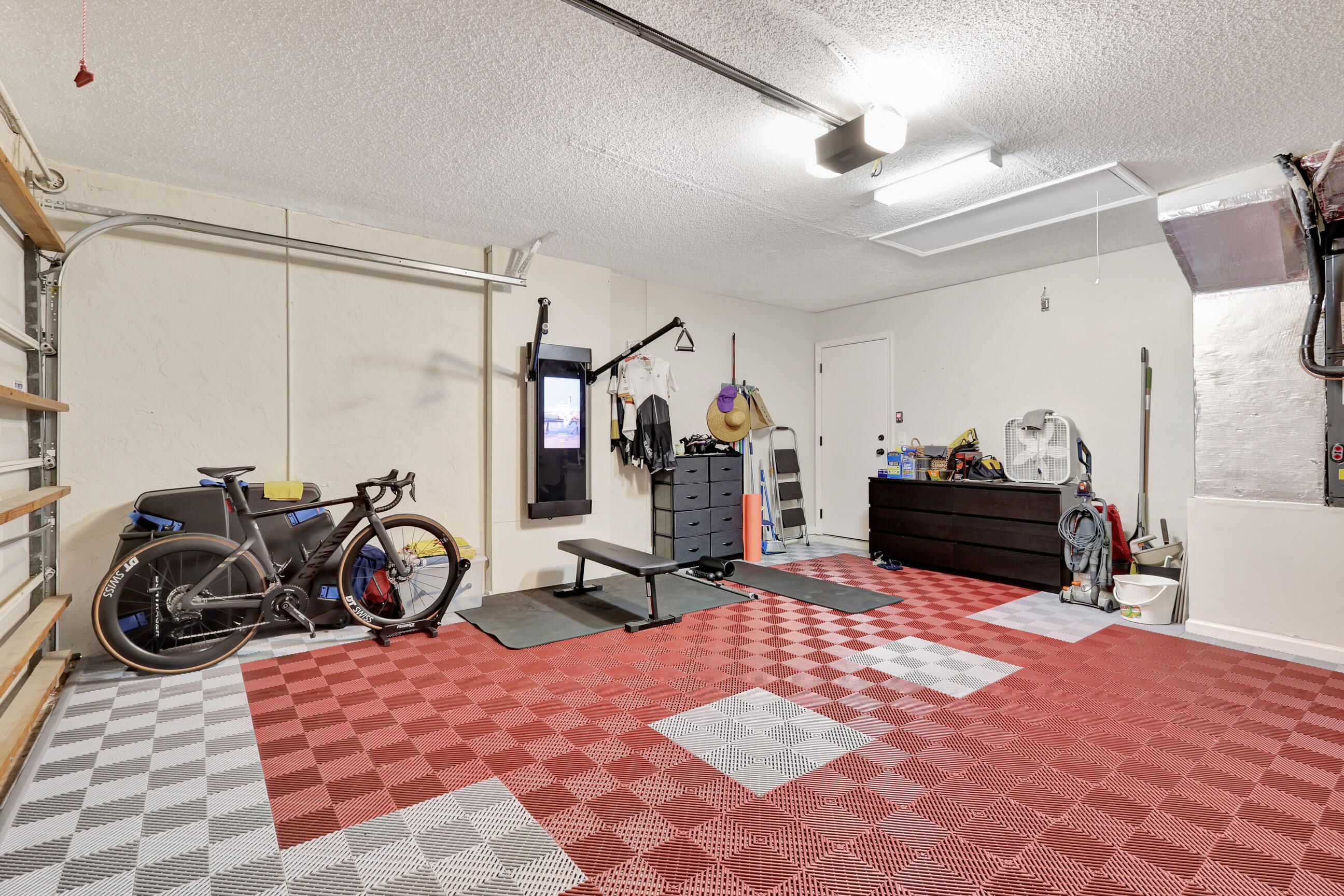 12204 Sunset Point Circle Wellington, FL 33414 - Photo 34 of 40 a bedroom with furniture and a gym equipment