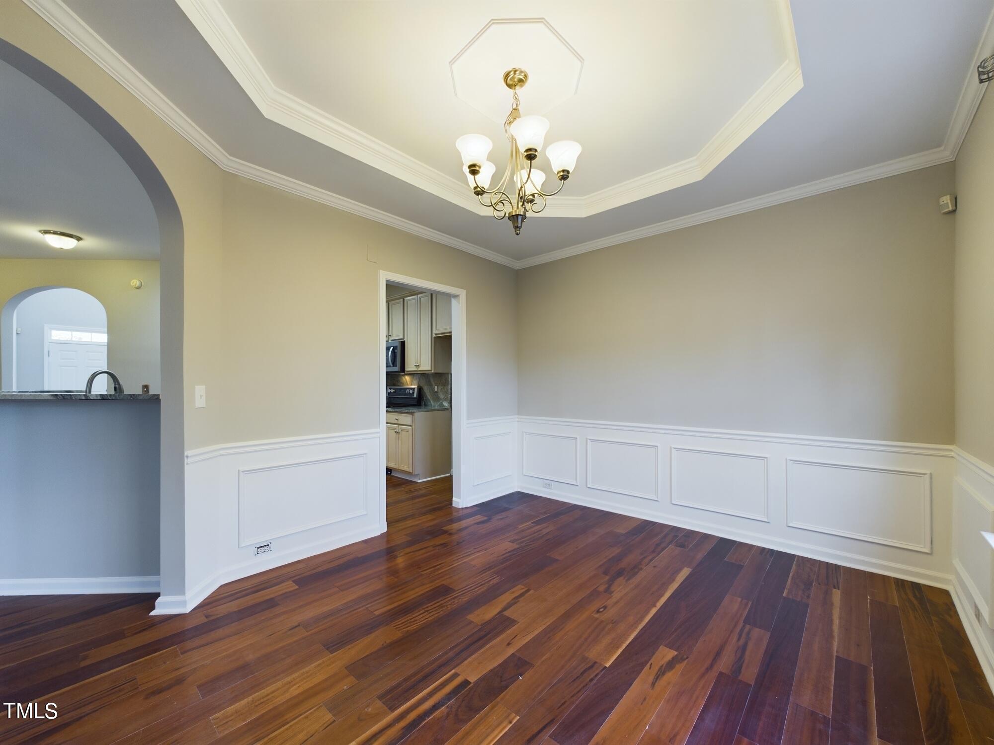 11124 Slider Drive Raleigh, NC 27614 - Photo 18 of 62 a view of an empty room with wooden floor and a window