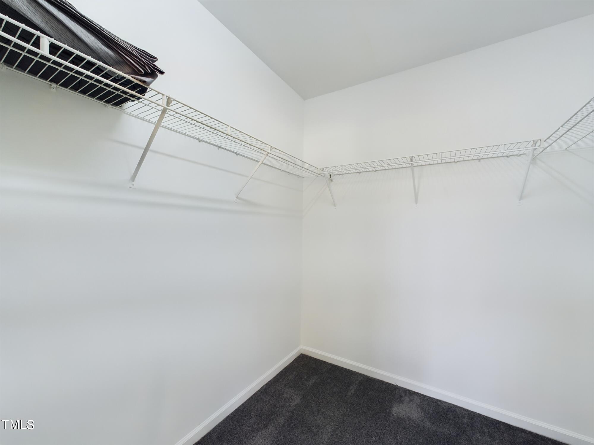 11124 Slider Drive Raleigh, NC 27614 - Photo 34 of 62 a view of a room with racks on the wall
