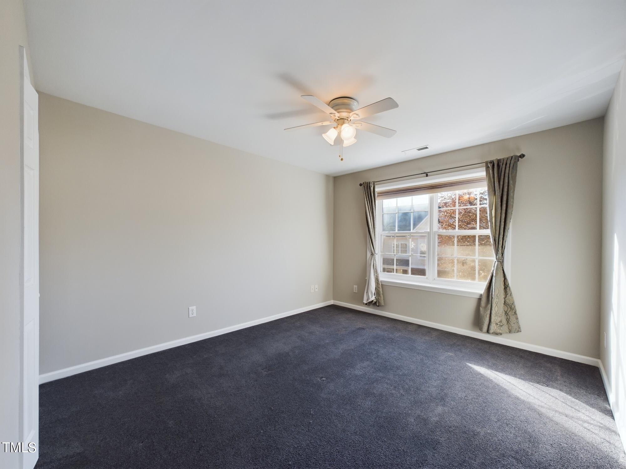 11124 Slider Drive Raleigh, NC 27614 - Photo 40 of 62 a view of an empty room with a window