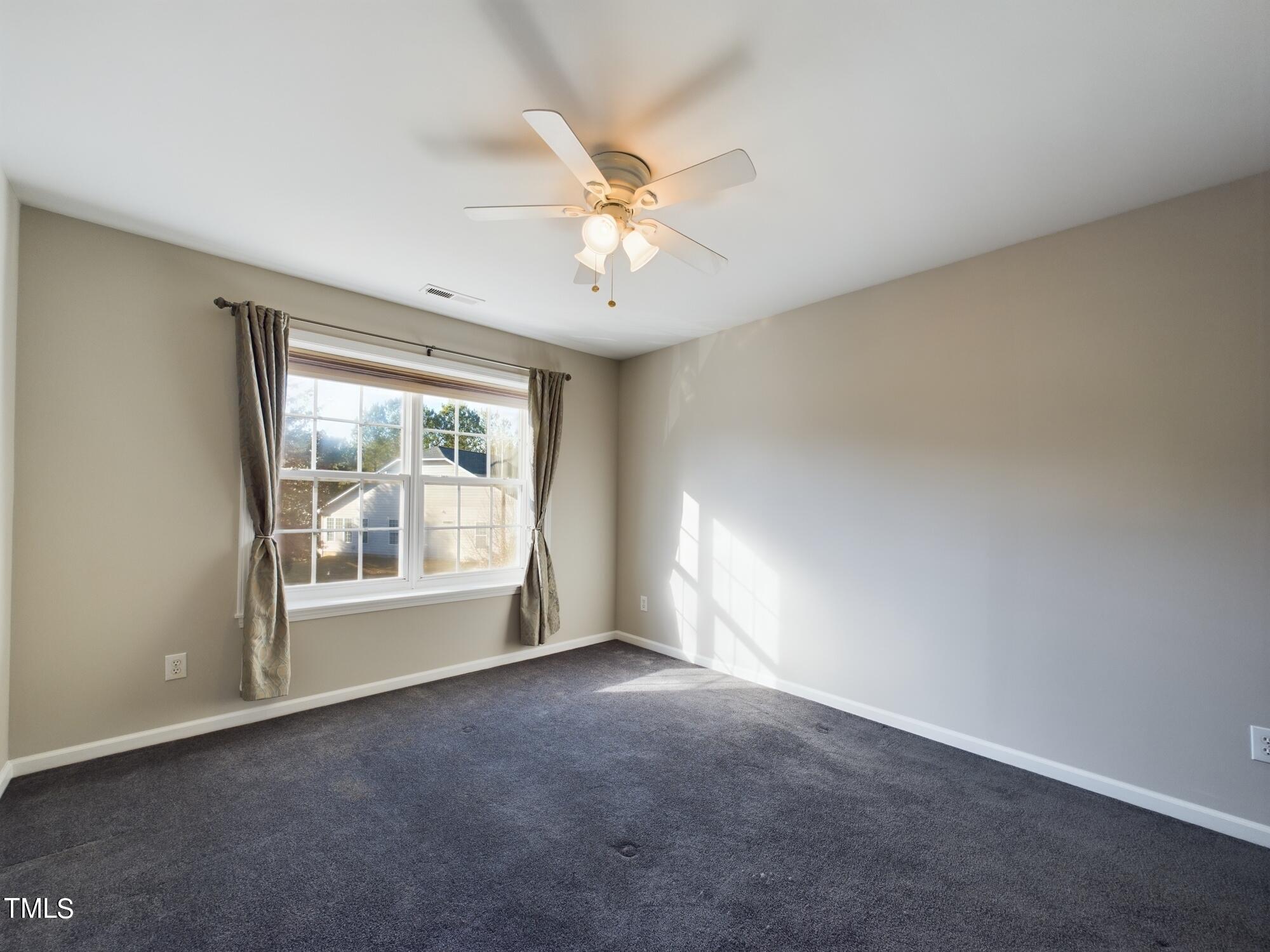 11124 Slider Drive Raleigh, NC 27614 - Photo 43 of 62 a view of an empty room with a window