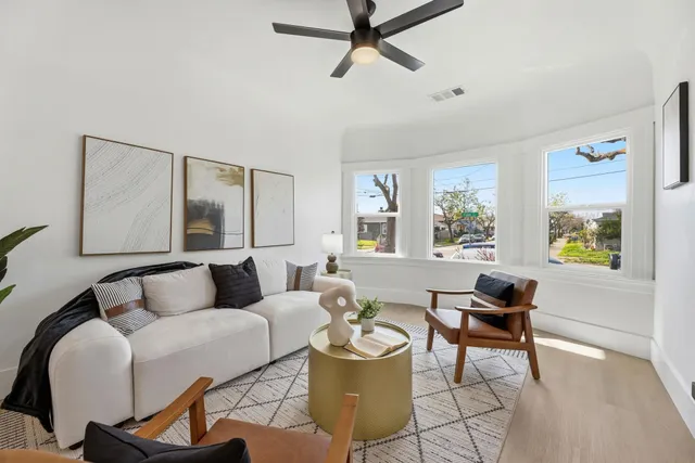 a living room with furniture and a window